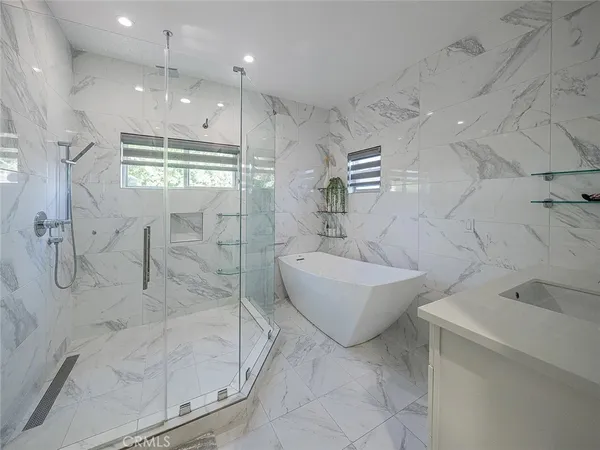 a bathroom with a bathtub and sink