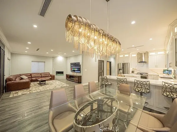 a kitchen with stainless steel appliances kitchen island granite countertop a sink and cabinets