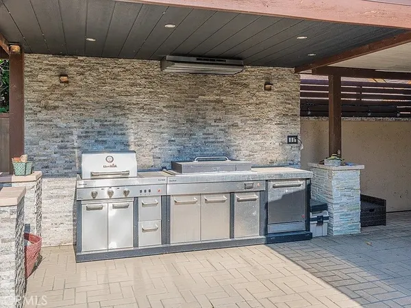 a kitchen with stainless steel appliances granite countertop a stove and a sink