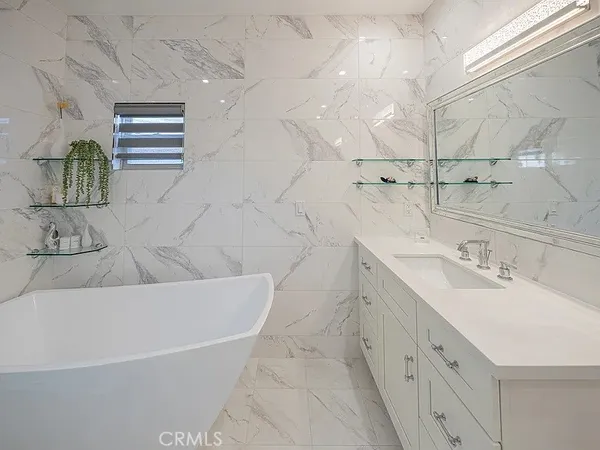 a bathroom with a double vanity sink and a mirror