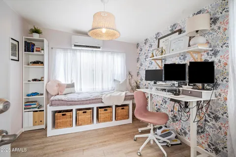 a kitchen with stainless steel appliances granite countertop a stove top oven a sink dishwasher and a dining table with wooden floor