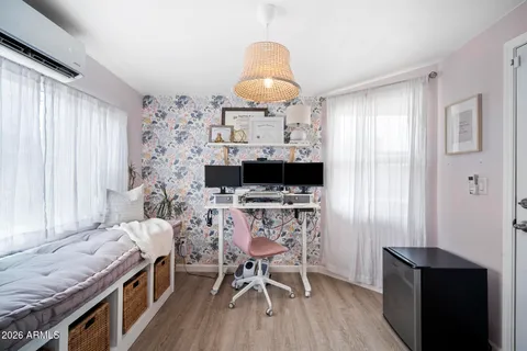 a bedroom with a large bed and a ceiling fan