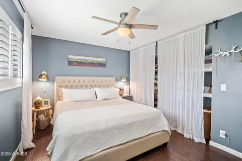 a bedroom with bed and a window