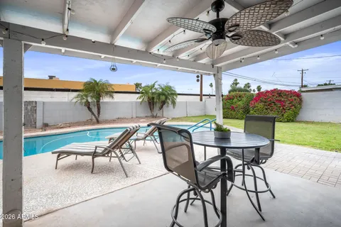 a view of a swimming pool with a patio