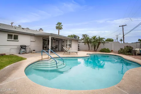 a view of a house with swimming pool