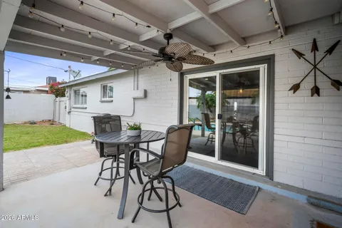 a kitchen with a table and chairs in it