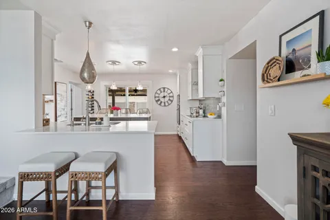 a view of a kitchen and dining room