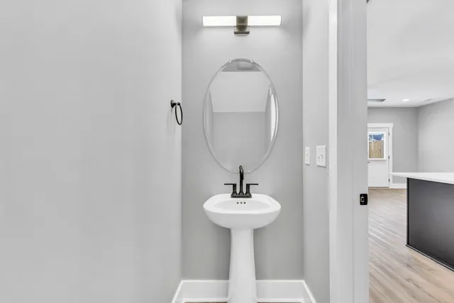 a bathroom with a sink and a mirror