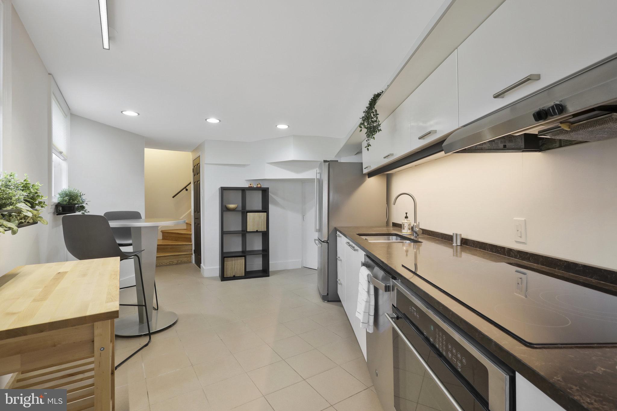 116 Commerce Street Alexandria, VA 22314 - Photo 32 of 50 Modern kitchen with sleek finishes.
