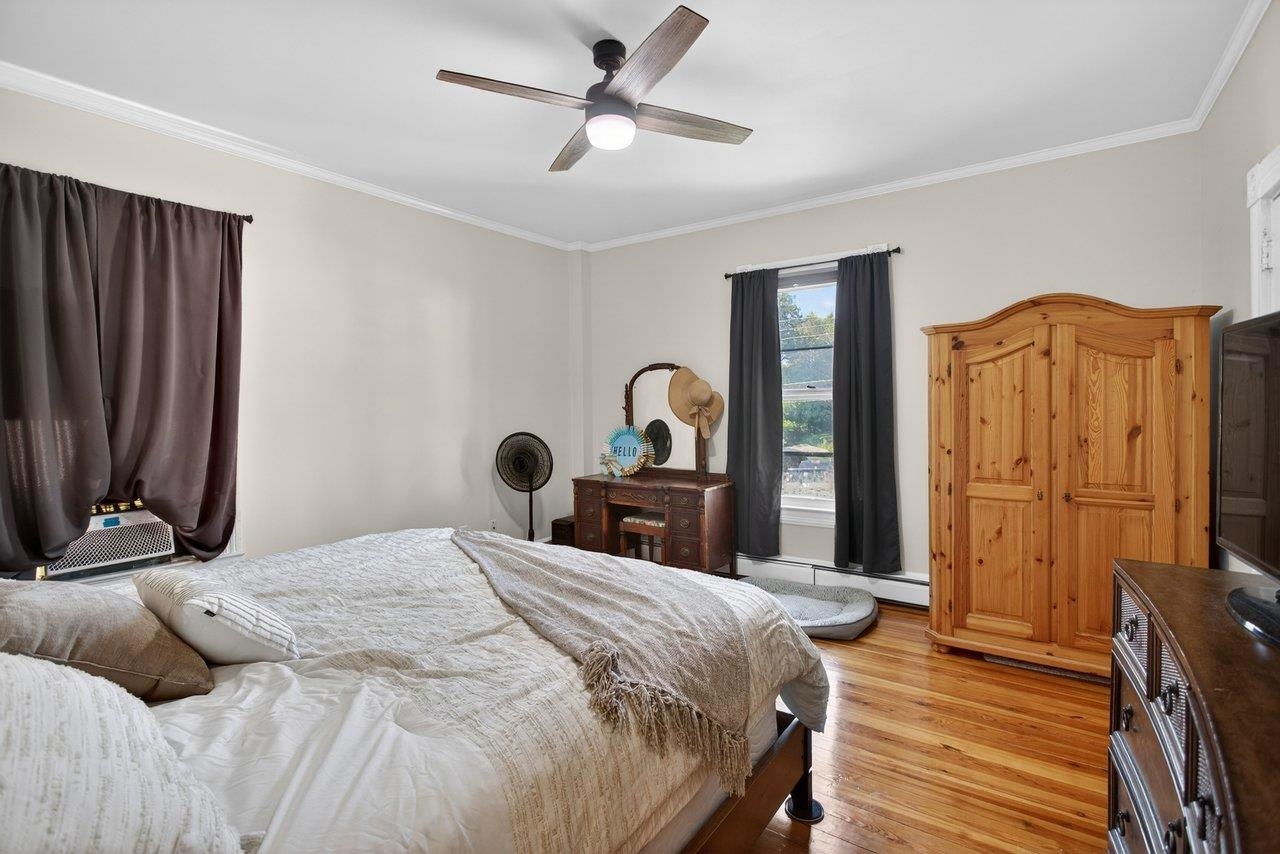 420 West Spring Street Woodstock, VA 22664 - Photo 21 of 67 a bedroom with a bed dresser and a large mirror