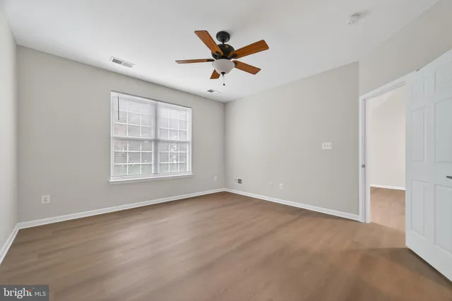 a bathroom with a granite countertop sink and shower