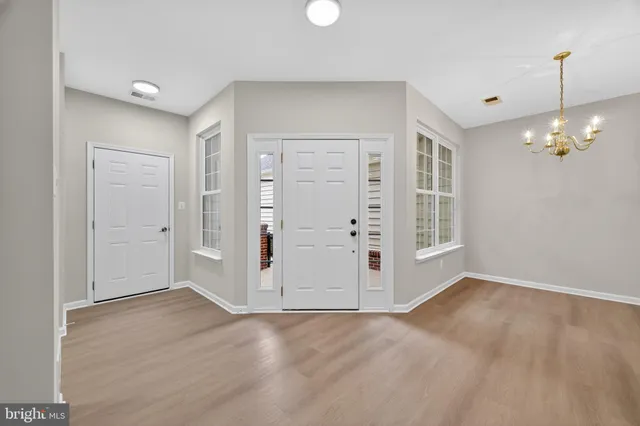 a view of wooden floor and stairs