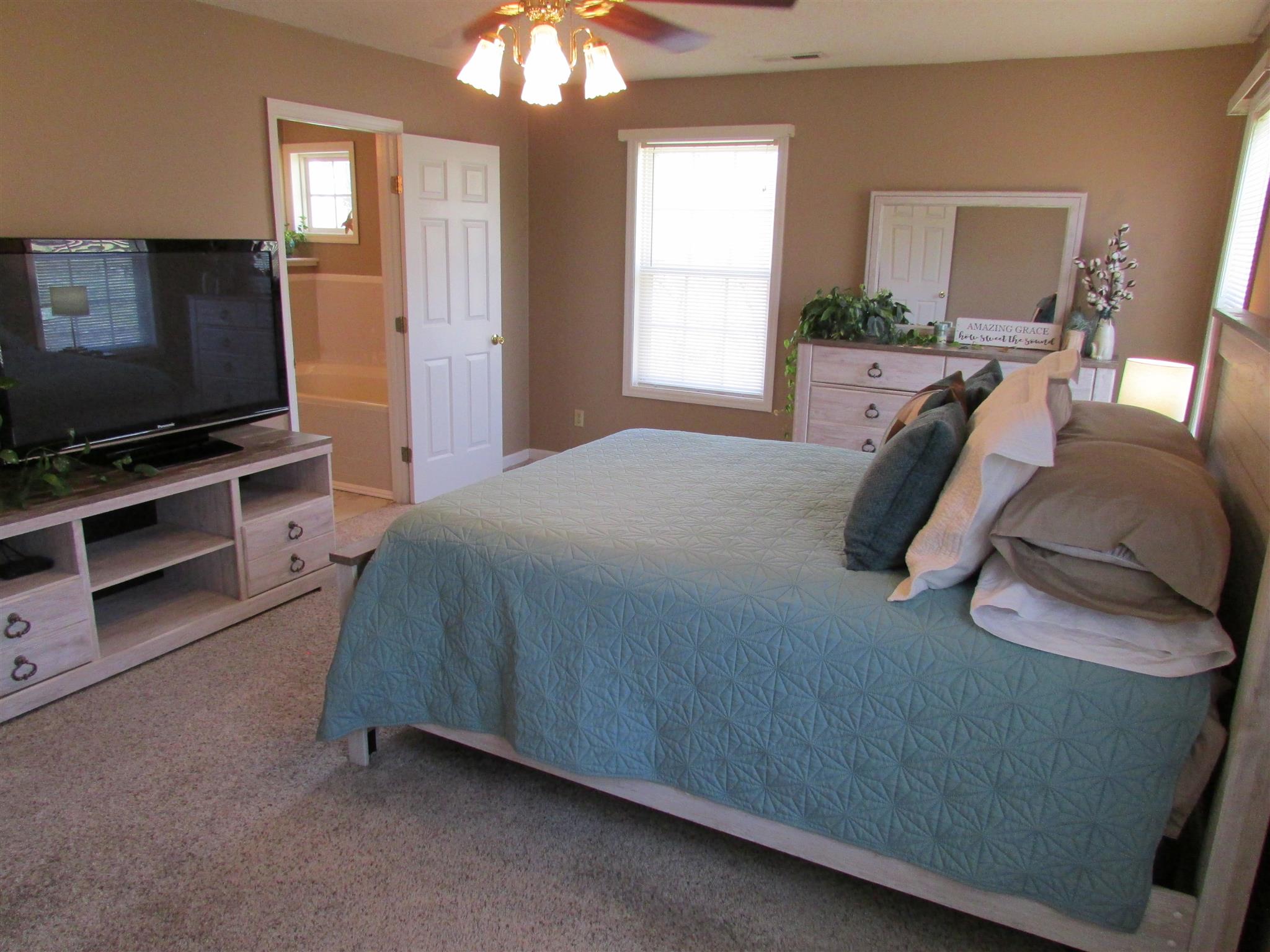 1550 Center Star Road Columbia, TN 38401 - Photo 23 of 30 a bedroom with a bed and a flat screen tv