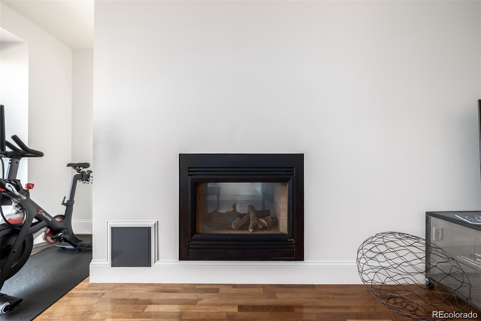 1560 Blake Street, Unit 810 Denver, CO 80202 - Photo 11 of 48 a living room with furniture and a fireplace