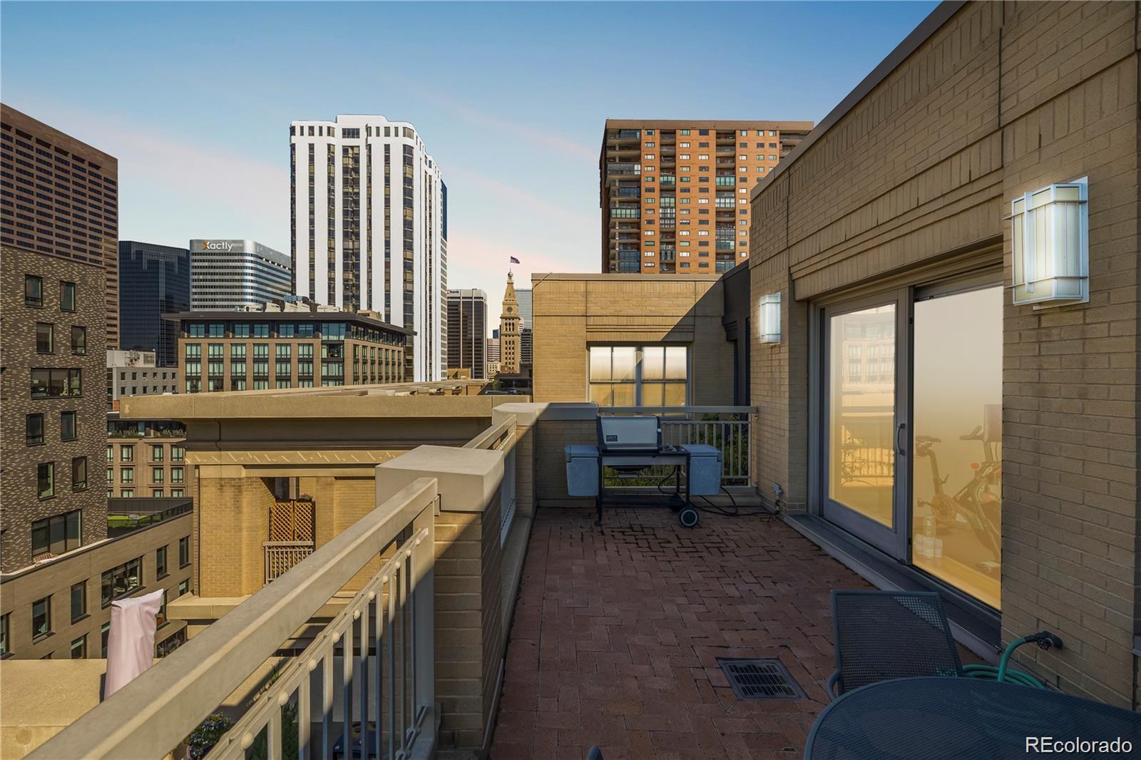 1560 Blake Street, Unit 810 Denver, CO 80202 - Photo 38 of 48 a view of a balcony with chairs