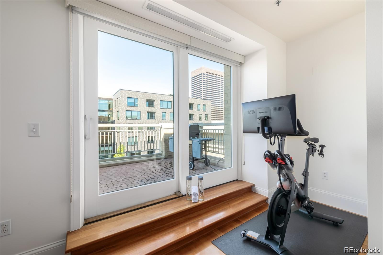 1560 Blake Street, Unit 810 Denver, CO 80202 - Photo 6 of 48 a view of a room with gym equipment