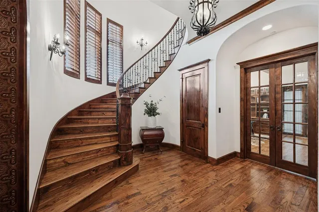 a view of entryway and hall with wooden floor