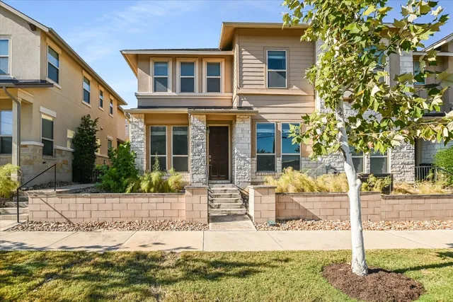 a front view of a house with garden
