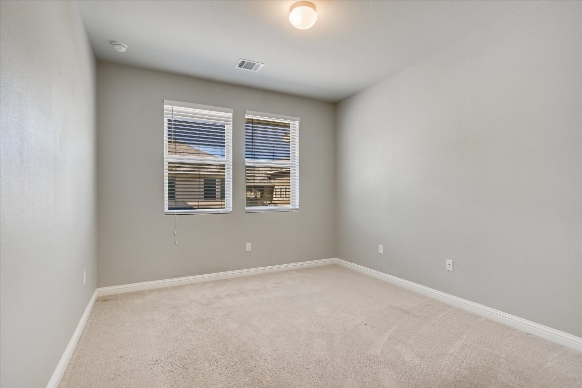 6814 East Riverside Drive, Unit 61 Austin, TX 78741 - Photo 5 of 10 an empty room with a window