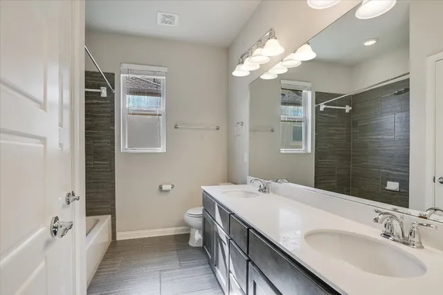 a bathroom with a sink a mirror and a shower