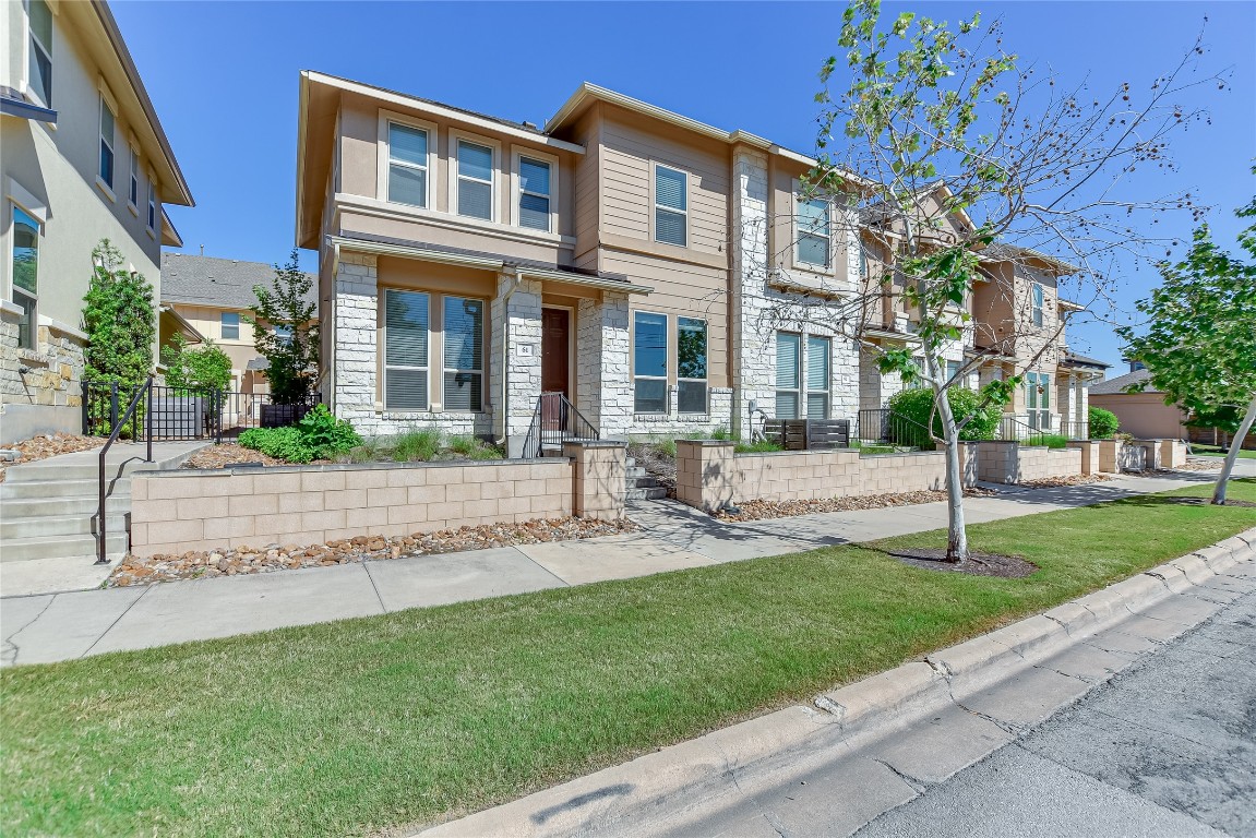 6814 East Riverside Drive, Unit 61 Austin, TX 78741 - Photo 8 of 10 a view of a brick building next to a yard