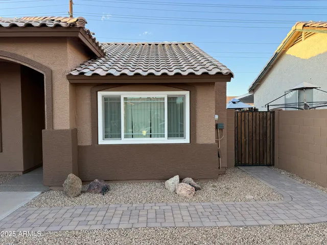 a kitchen with granite countertop a refrigerator and a stove