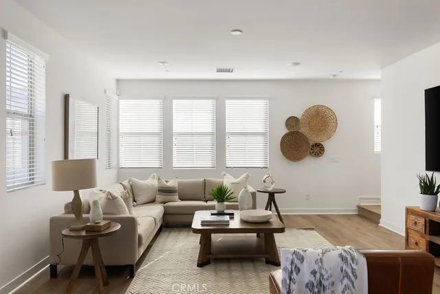 a bedroom with bed and a large window