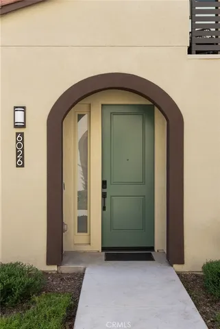 a front view of a house with wooden walls