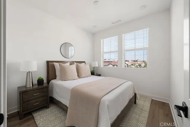 a bedroom with bed and window