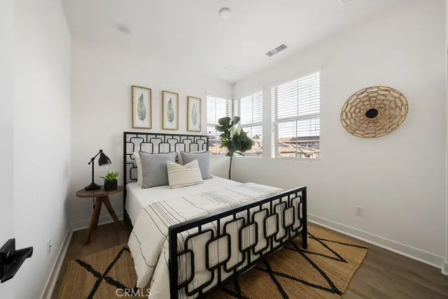 a view of a room that has a table and a chair in it