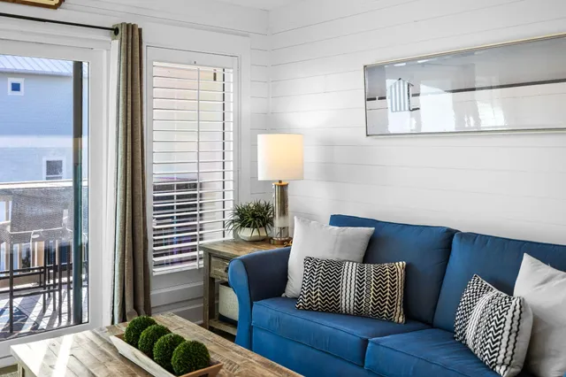 a view of an entryway with wooden floor and a fireplace