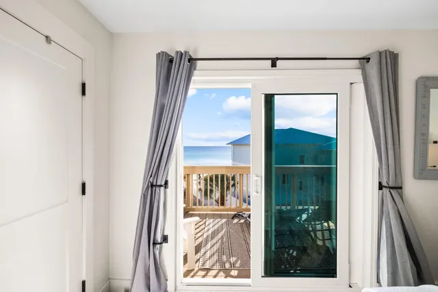 a view of a balcony with wooden floor