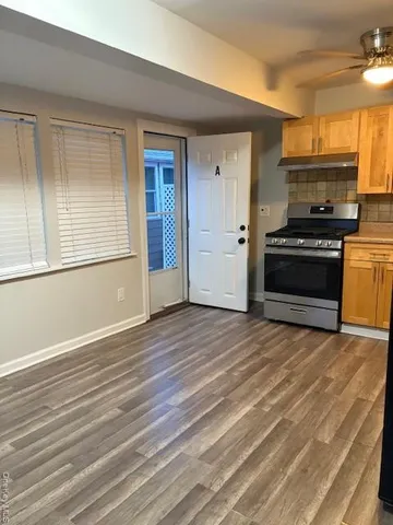 a view of kitchen and wooden floor