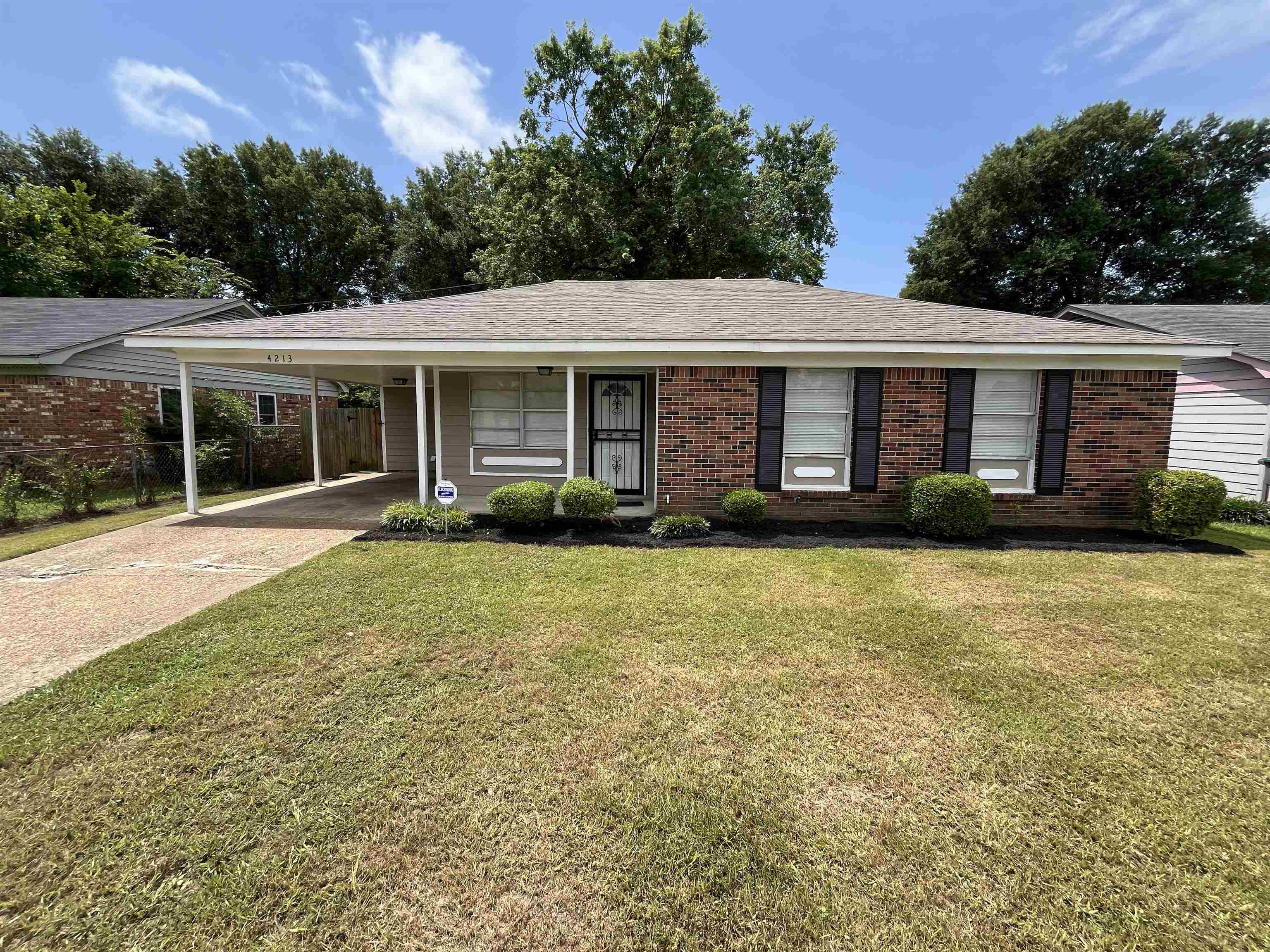 4213 Cochese Road Memphis, TN 38118 - Photo 1 of 11 Single story home featuring a carport, brick siding, and concrete driveway