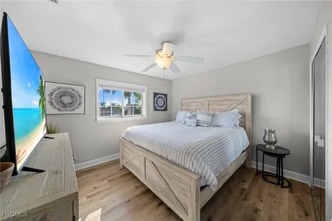 a bedroom with a bed and a desk