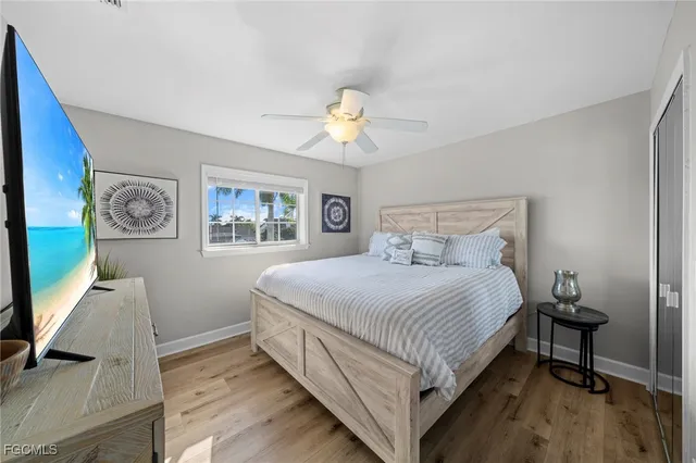 a bedroom with a bed and a desk