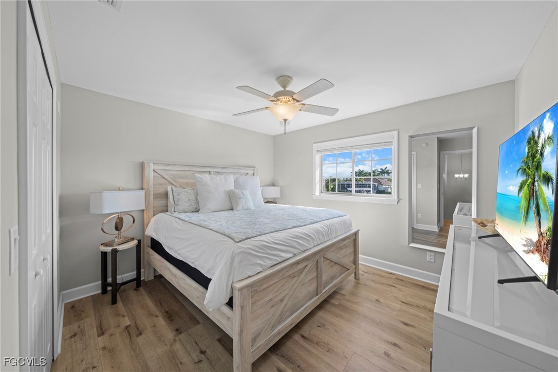 5303 Southwest 26th Court Cape Coral, FL 33914 - Photo 24 of 45 a bedroom with a bed and a flat tv screen on dresser