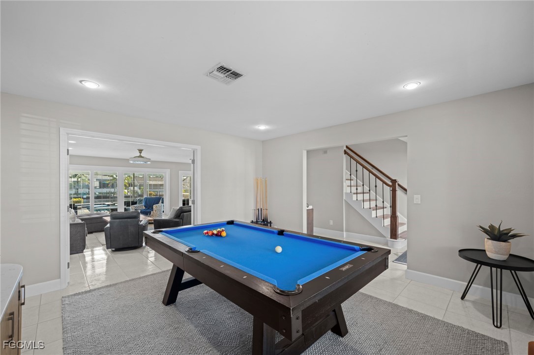 5303 Southwest 26th Court Cape Coral, FL 33914 - Photo 28 of 45 a room with pool table and windows