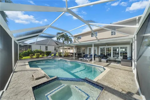 a view of a swimming pool with sitting area