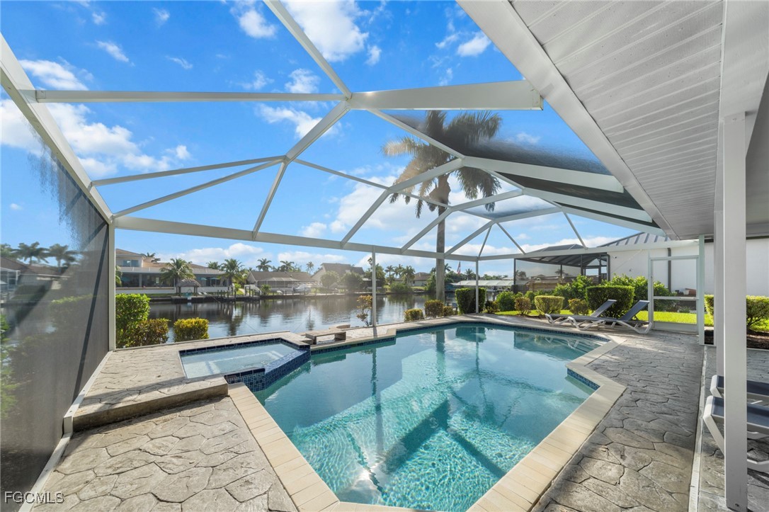 5303 Southwest 26th Court Cape Coral, FL 33914 - Photo 33 of 45 a view of a swimming pool with a patio