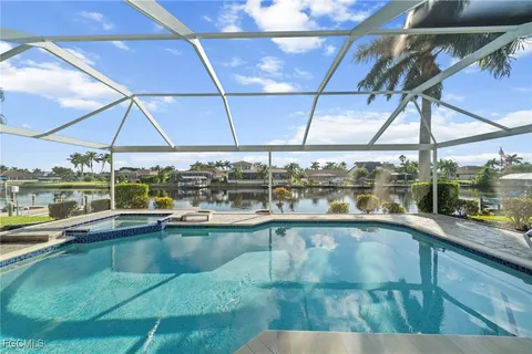 a view of a swimming pool with a porch