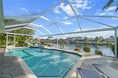 a view of a swimming pool with a patio