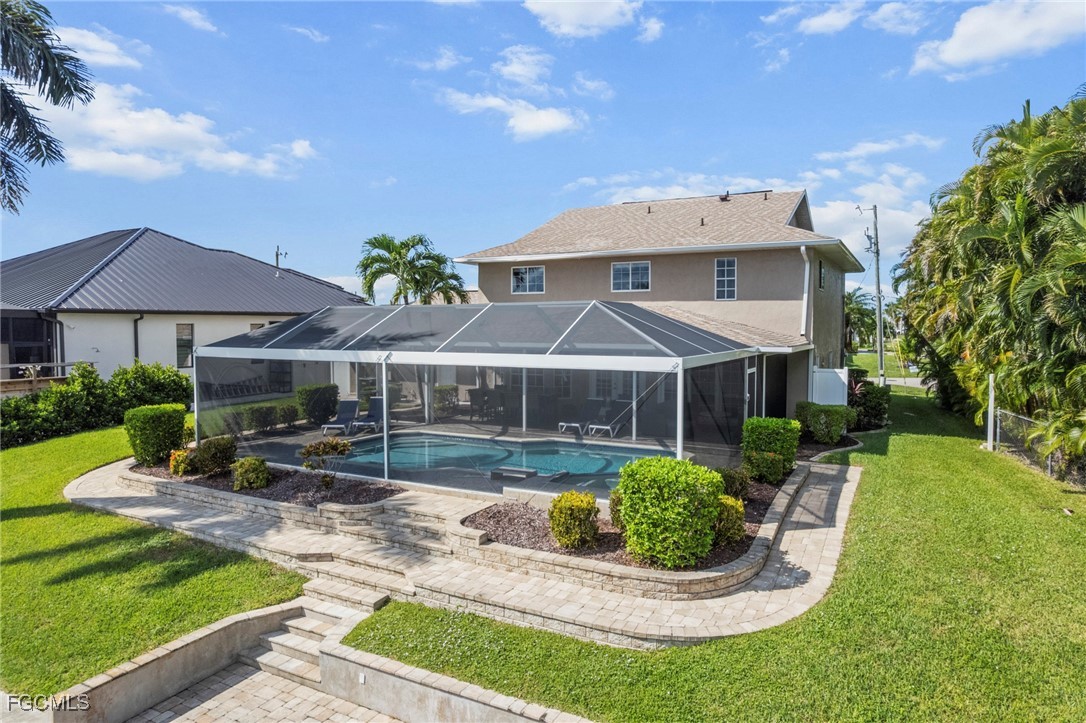 5303 Southwest 26th Court Cape Coral, FL 33914 - Photo 37 of 45 a front view of a house with garden