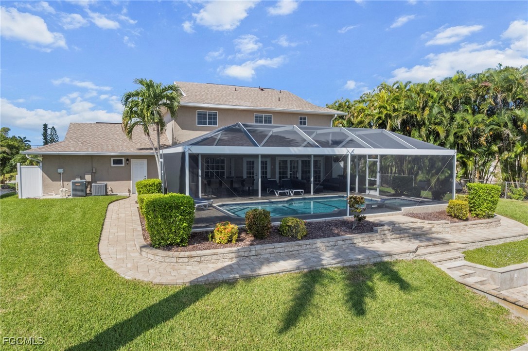 5303 Southwest 26th Court Cape Coral, FL 33914 - Photo 38 of 45 a view of a house with swimming pool and sitting area