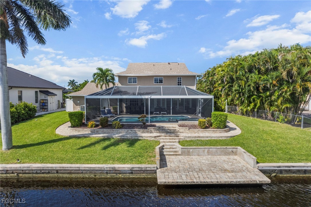 5303 Southwest 26th Court Cape Coral, FL 33914 - Photo 39 of 45 a front view of a house with garden