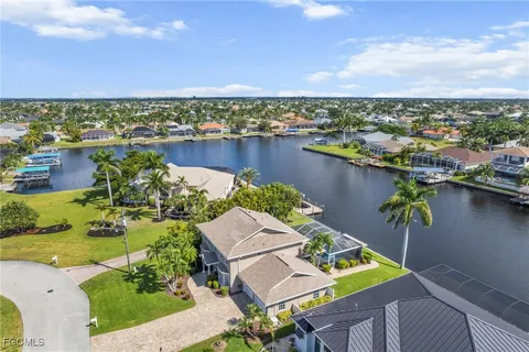 an aerial view of a house with outdoor space