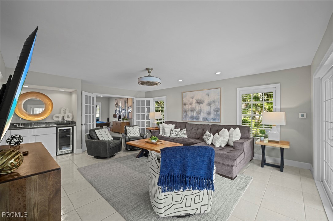 5303 Southwest 26th Court Cape Coral, FL 33914 - Photo 5 of 45 a living room with furniture a rug and a window