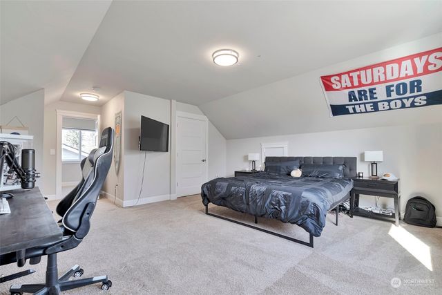 a living room with a couch and a flat screen tv