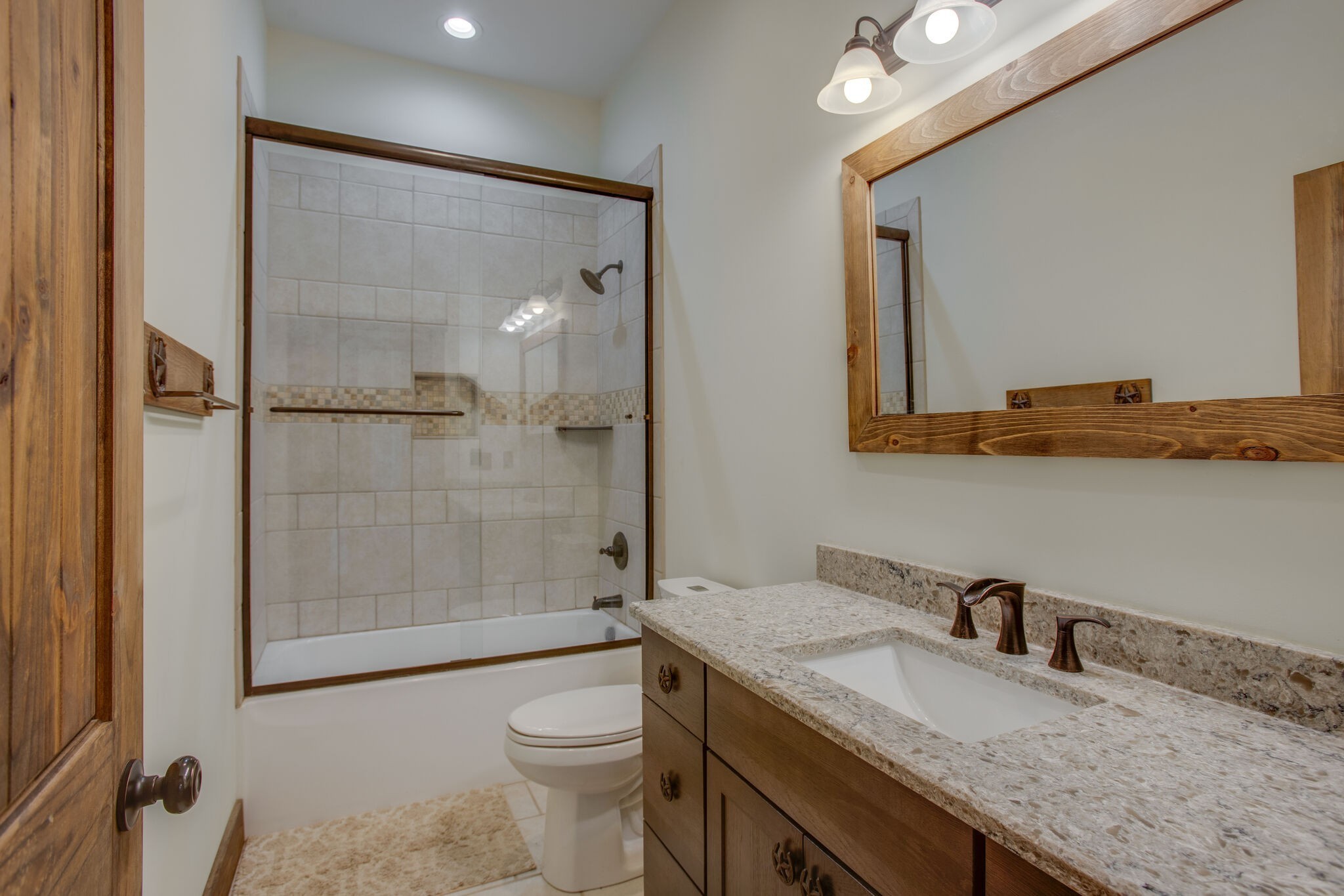 103 Heath Branch Road Chapel Hill, TN 37034 - Photo 22 of 49 a bathroom with a granite countertop sink a toilet and shower