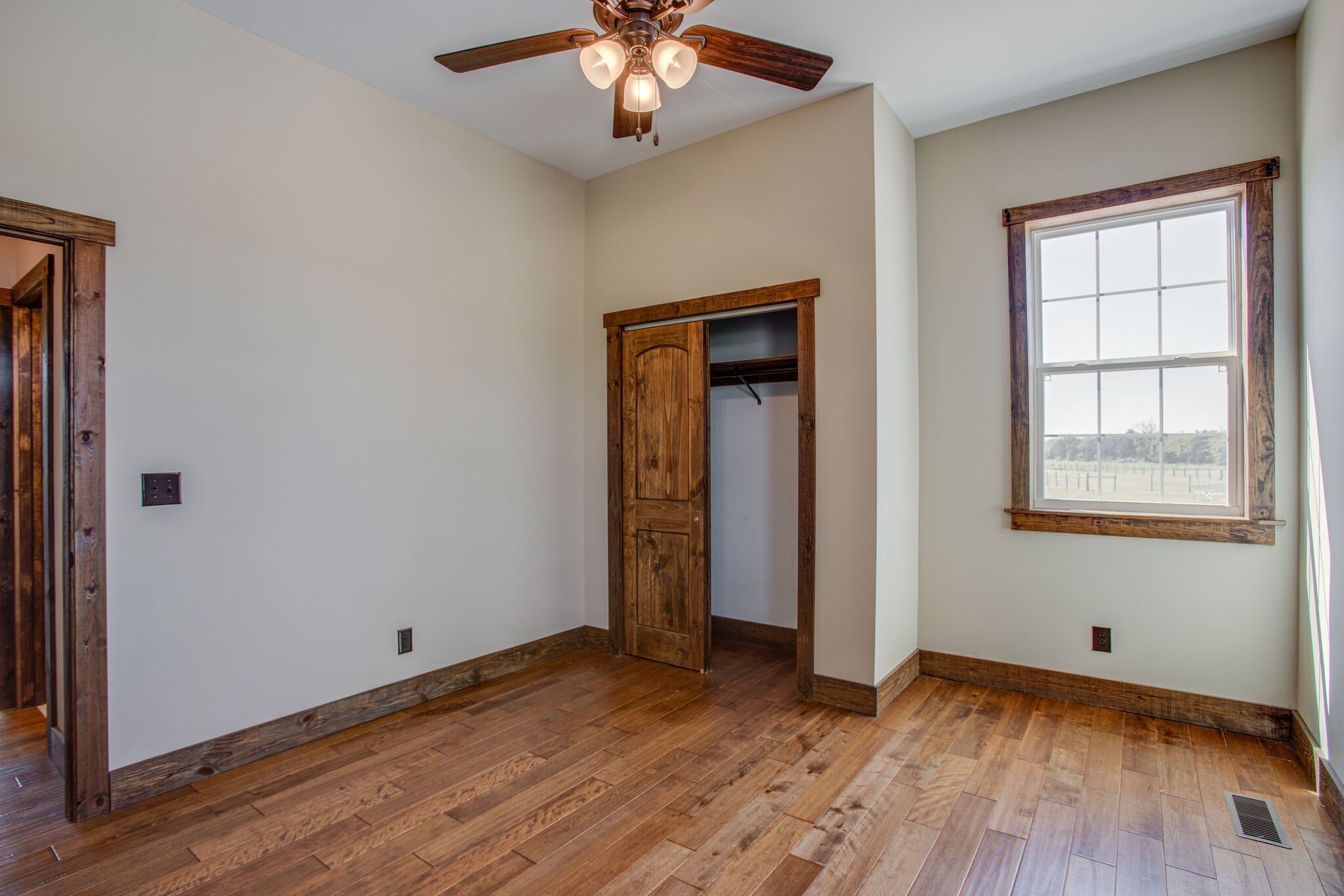 103 Heath Branch Road Chapel Hill, TN 37034 - Photo 25 of 49 an empty room with wooden floor and windows